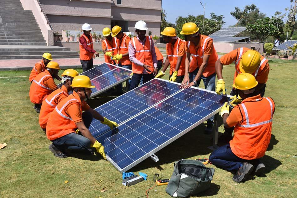 Workers installing solar panels